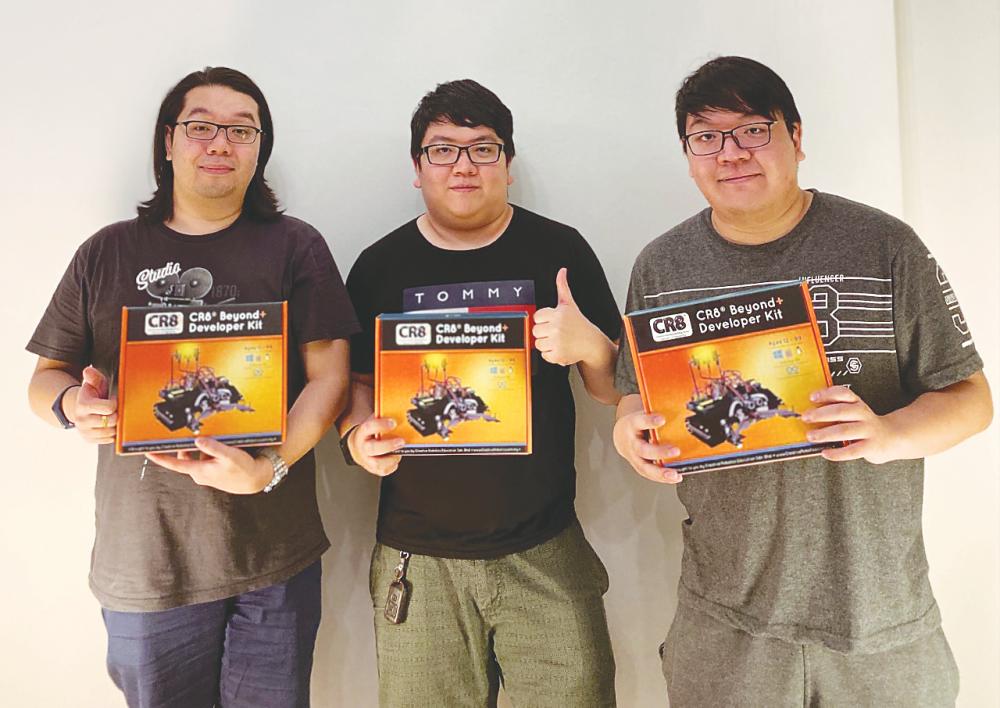 From left: First City UC FEC Alumni and brothers Yee Jun, Yee Jian and Yee Juan with their CR8 Beyond Developer Kit.