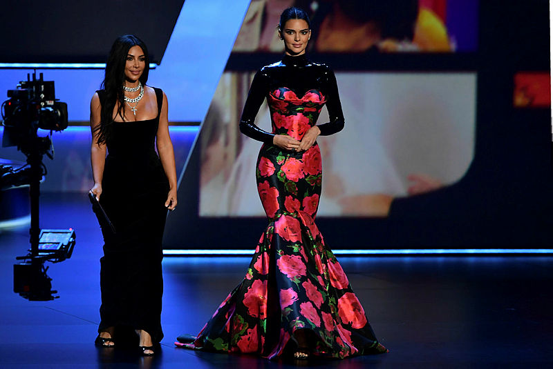 US television personalities Kim Kardashian (L) and Kendall Jenner arrive to present the award for Outstanding Competition Program onstage during the 71st Emmy Awards at the Microsoft Theatre in Los Angeles on Sept 22, 2019. — AFP