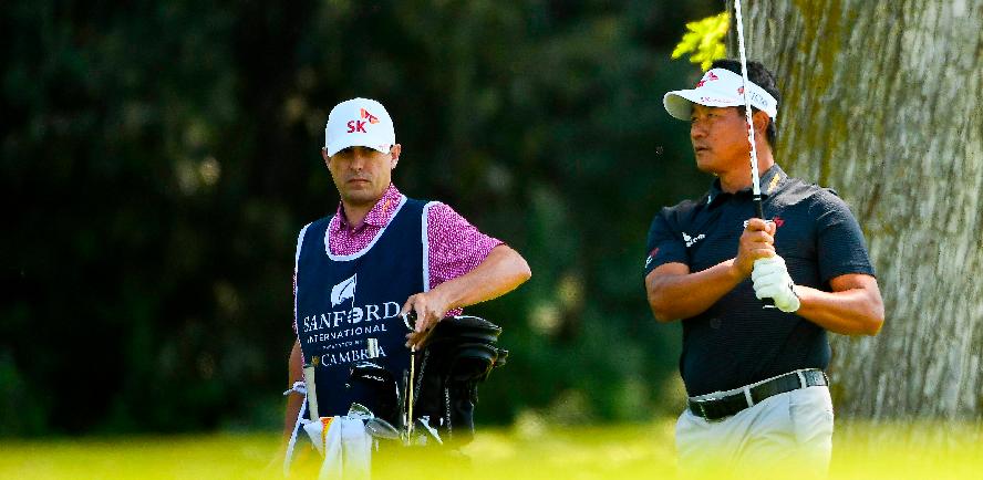 KJ Choi (left) shoots his second shot on the 5th hole during the first round of the Sanford International. – AFPPIX