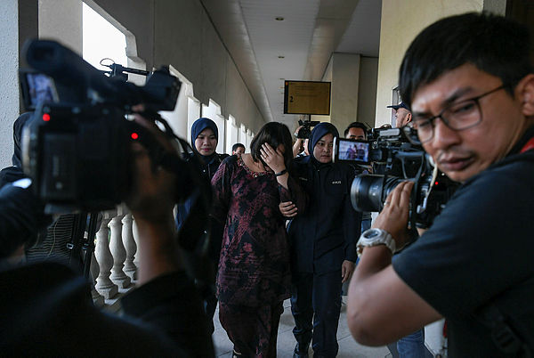 Former secretary at the Finance Ministry’s Treasury deputy secretary-general (Investment)’s office, Rohaya Sabot, 39, was charged in the Kuala Lumpur sessions court today on five charges, including two charges of corruption involving purchase of a government property in Hong Kong last year. - Bernama