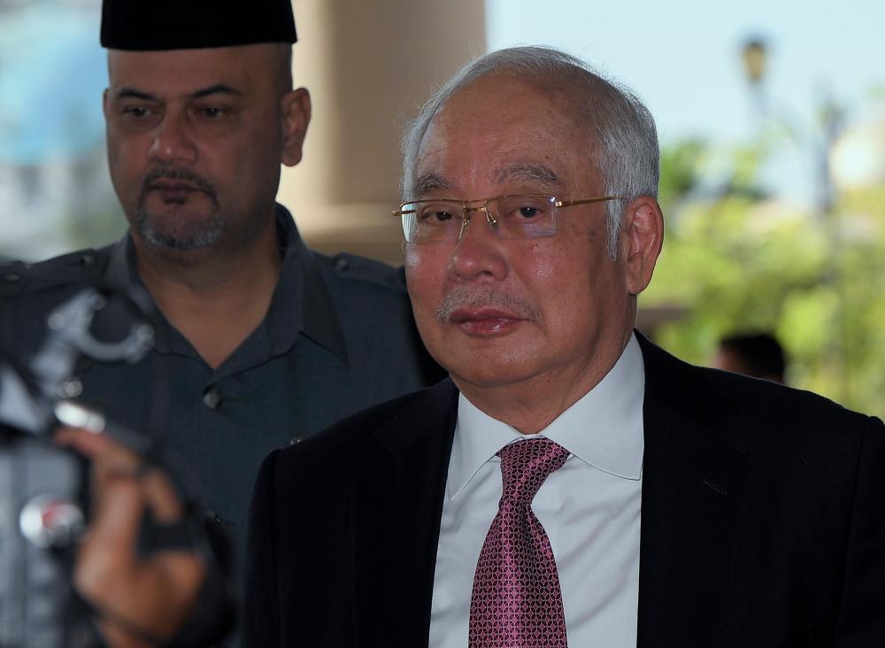 Former prime minister Datuk Seri Najib Abdul Razak arrives the Kuala Lumpur Court Complex earlier today. - Bernama