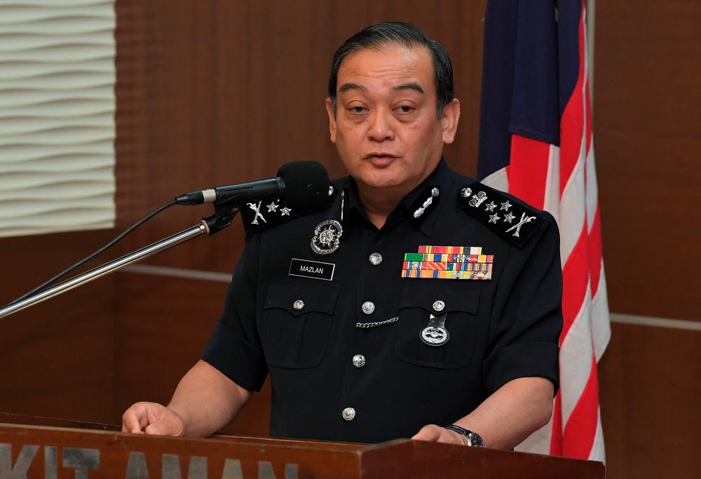 Deputy Inspector-General of Police Datuk Mazlan Mansor speaks at the award presentation ceremony for the best Op Selamat 16 contingent and district at Bukit Aman today. - Bernama