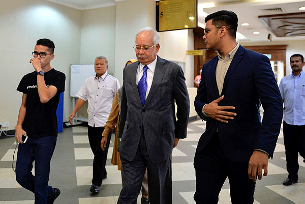 Former prime minister Datuk Seri Najib Abdul Razak arrives at the Kuala Lumpur Court Complex today to participate in the case management alleged for the SRC International money laundering case, on March 13, 2019. — Bernama