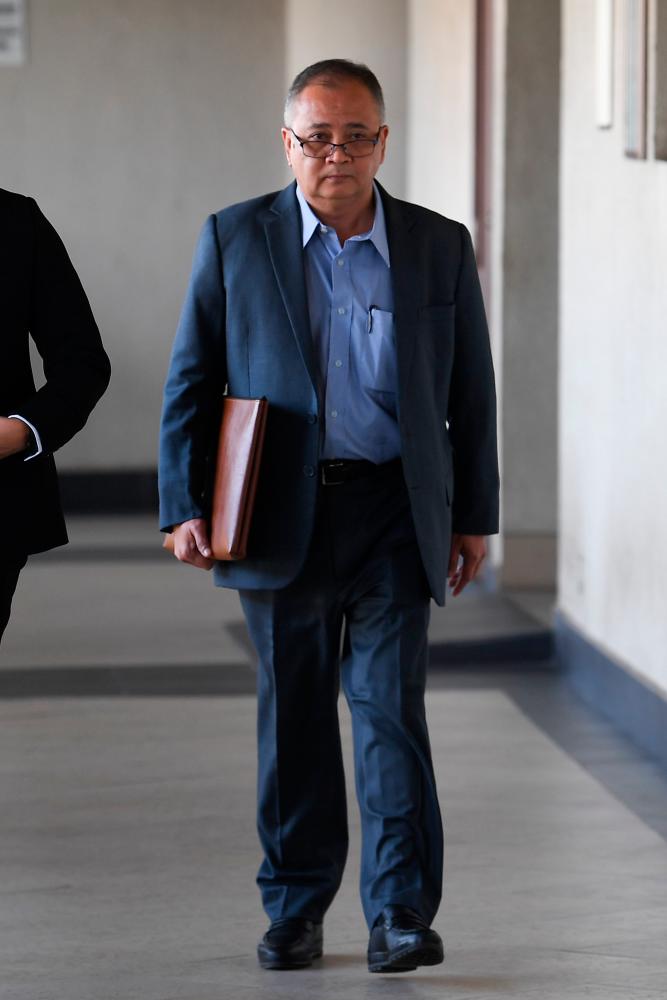 Mohd Isa’s former special officer, Muhammad Zahid Md Arip attends the trial at the Kuala Lumpur High Court today. - Bernama
