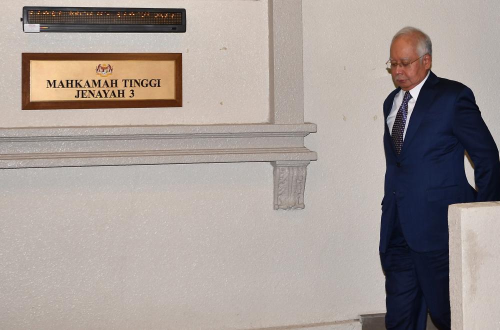 Former prime minister Datuk Seri Najib Abdul Razak leaves the High Court after mention of seven counts involving SRC International Sdn Bhd funds amounting to RM42 million, on March 22, 2019. — Bernama