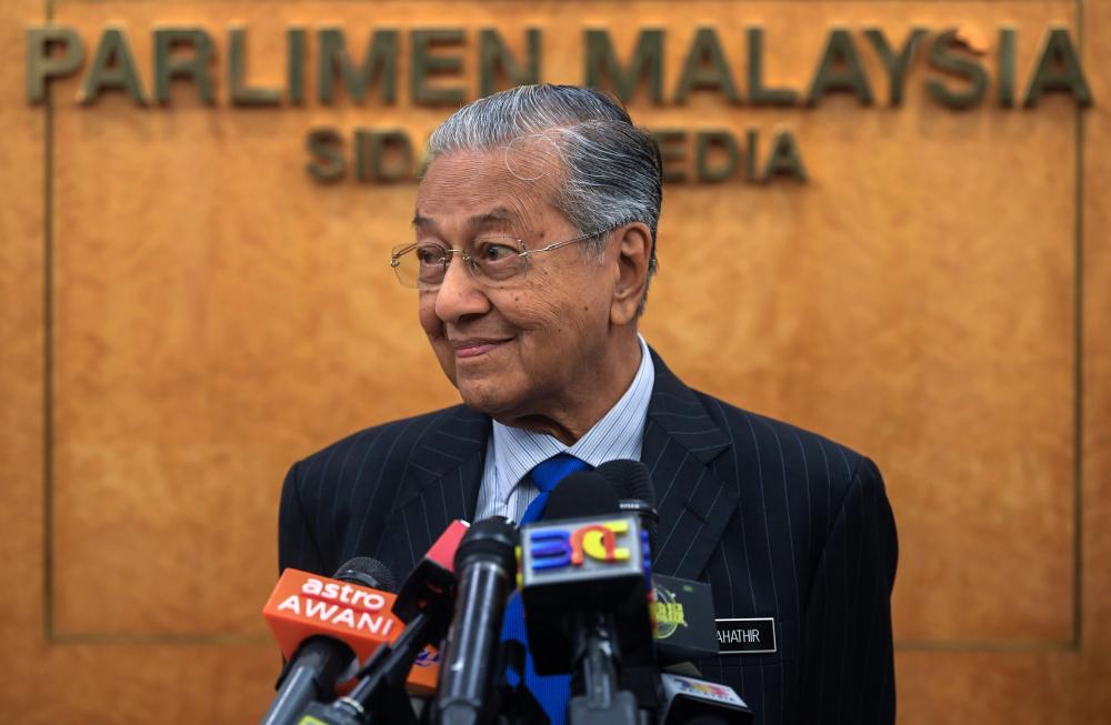 Prime Minister Tun Dr Mahathir Mohamad speaks at a press conference at Parliament today  - Bernama