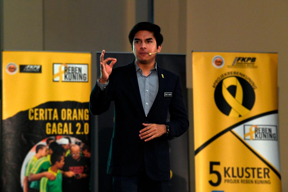 Youth and Sports Minister Syed Saddiq Syed Abdul Rahman delivers a speech at the launch of the second edition of the Yellow Ribbon project at Spacerubix in Puchong today. - Bernama