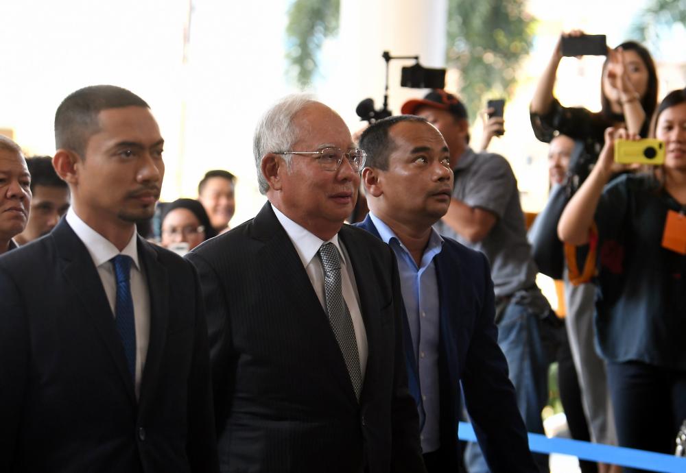 Former Prime Minister Datuk Seri Najib Abdul Razak (2L) arrives at the Kuala Lumpur Court Complex on the second day of the hearing on the misappropriation of SRC International Sdn Bhd’s funds, on April 15, 2019. — Bernama