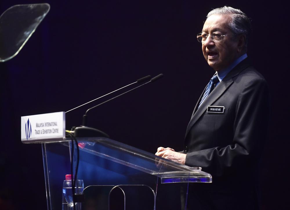 Prime Minister Tun Dr Mahathir Mohamad gives a speech at the Beyond Paradigm Summit 2019 today. - Bernama