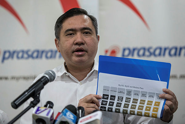 Transport Minister Anthony Loke Siew Fook showing a chart of information on My100 and My50 passes, during a press conference at Prasarana Malaysia Berhad Headquarters yesterday. — Bernama