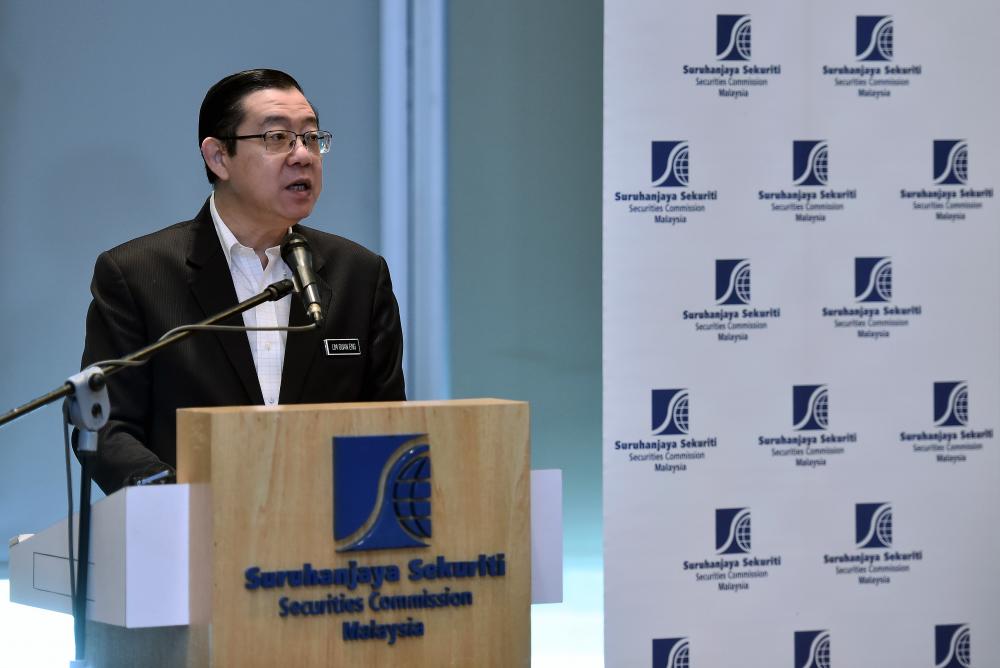 Finance Minister Lim Guan Eng speaks at the launch of the Securities Commission Malaysia Fintech Roundtable 2019. - Bernama