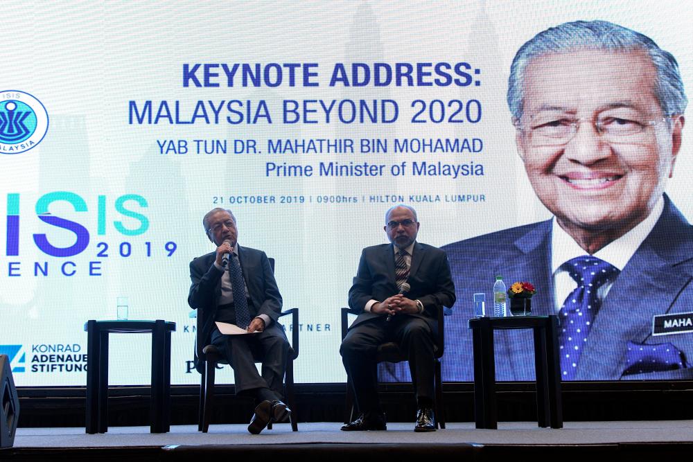 Prime Minister Tun Dr Mahathir Mohamad answering a question at the Isis Malaysia Praxis Conference “Malaysia Beyond 2020” here on Oct 21, 2019. — Bernama