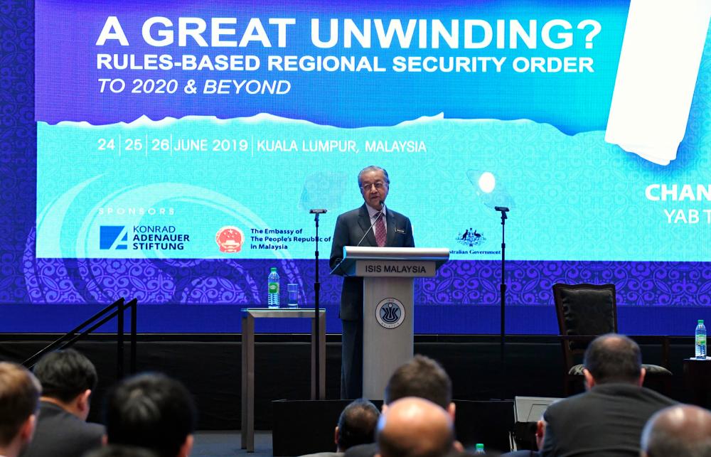 Prime Minister Tun Dr Mahathir Mohamad delivers his keynote address entitled ‘New Malaysia in a Changing Regional Order’ during the 33rd Asia Pacific Roundtable on June 25, 2019. - Bernama