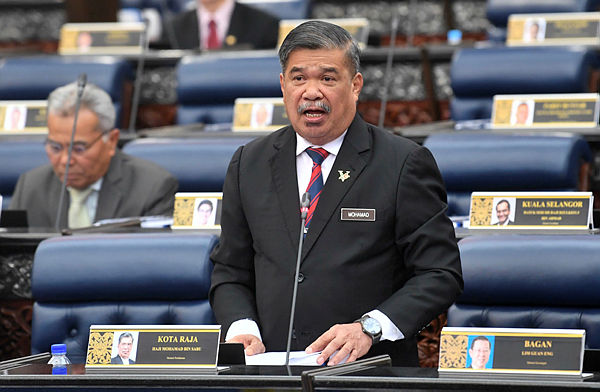 Defence Minister Mohamad Sabu tabling the Defence White Paper at the Dewan Rakyat yesterday. — Bernama