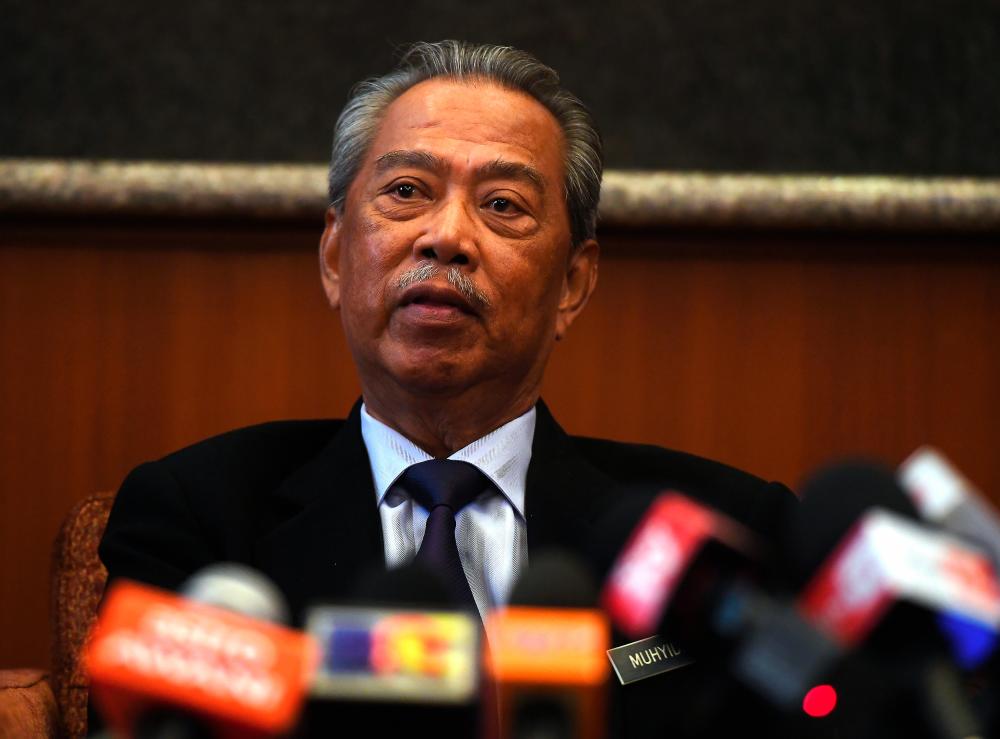 Home Minister Tan Sri Muhyiddin Yassin speaks to the media at a press conference after his ministry’s monthly gathering in Putrajaya this morning. - Bernama