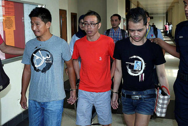 Three men (from L) Mohamad Yazid Kong Abdullah, 52, Chow Mun Fai, 43, and Danny Antoni, 28, who were charged with 11 counts of insulting Prophet Muhammad and Islam on social media. — Bernama