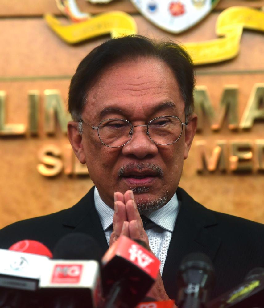 Port Dickson MP Datuk Seri Anwar Ibrahim speaks at a press conference in Parliament today. - Bernama