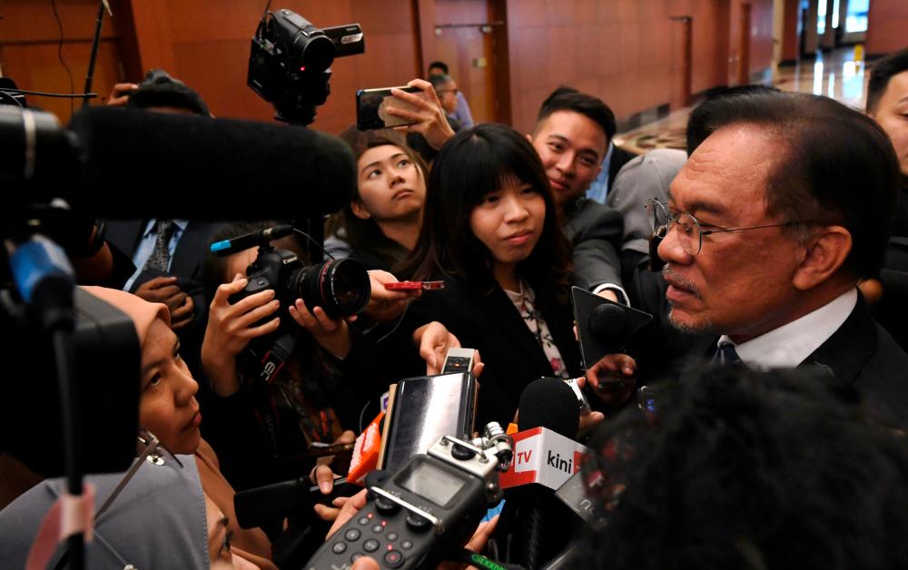 Port Dickson MP and PKR President Datuk Seri Anwar Ibrahim speaks to reporters at the Parliament lobby today. - Bernama