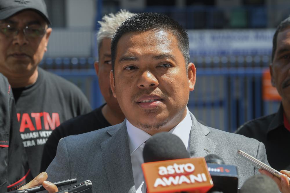 Special Tasks Officer 2 at Defence Minister’s Office Rafizal Ali speaks to media inquiries after lodging a police report at the Wangsa Maju Police Station, on Feb 26, 2019. — Bernama