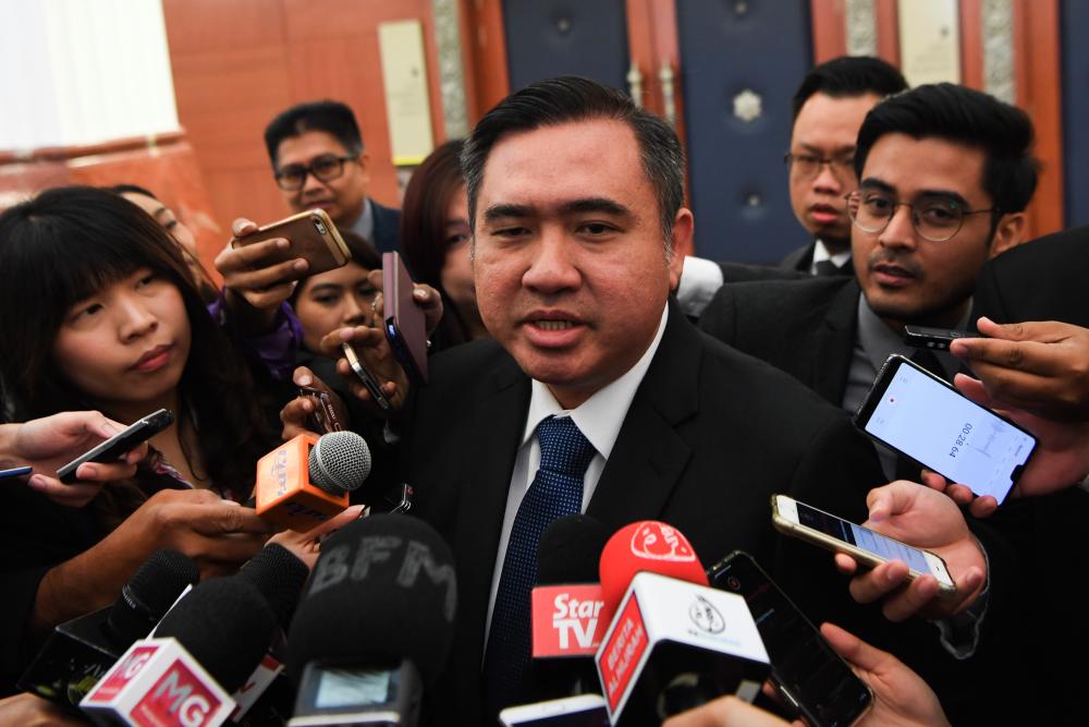Transport Minister Anthony Loke Siew Fook answers questions from the media in the Parliament lobby today. - Bernama