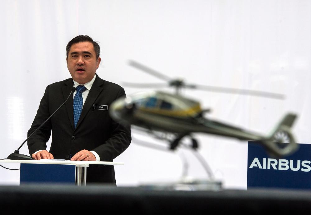 Transport Minister Anthony Loke Siew Fook delivers a speech during the opening ceremony of the Airbus Helicopter’s completion and delivery centre at Helicopter Centre Malaysia International Aerospace Centre, in Subang today. - Bernama