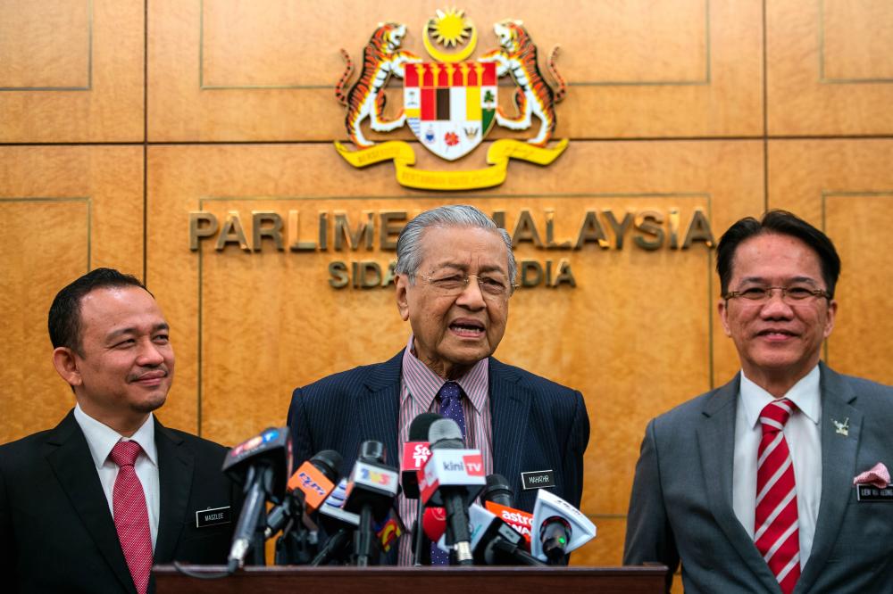 Prime Minister Tun Dr Mahathir Mohamad speaks during a press conference after today’s parliamentary session. On his left is Education Minister Dr Maszlee Malik and on his right is Minister in the Prime Minister’s Department (Law) Datuk Liew Vui Keong. - Bernama