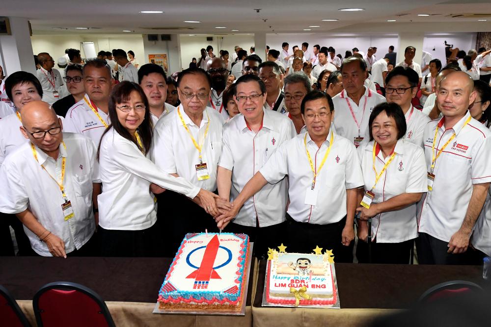 DAP Secretary-General Lim Guan Eng and other senior party officials cut a cake in conjunction with the opening of the 2019 Kuala Lumpur Federal Territories DAP convention today. - Bernama