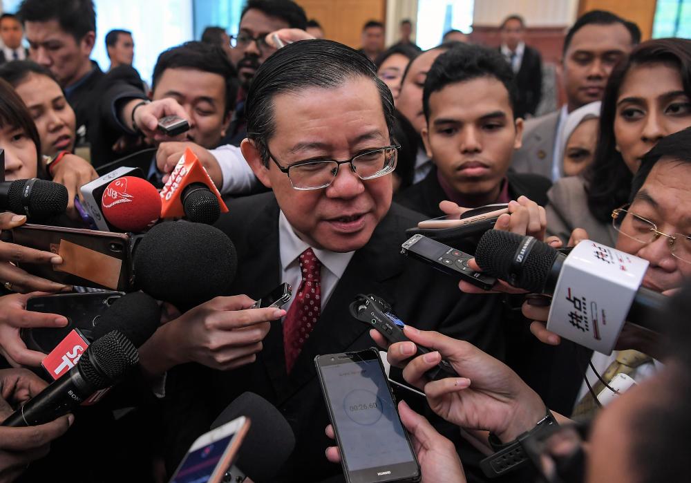 Finance Minister Lim Guan Eng is interviewed by the media at Parliament today. - Bernama