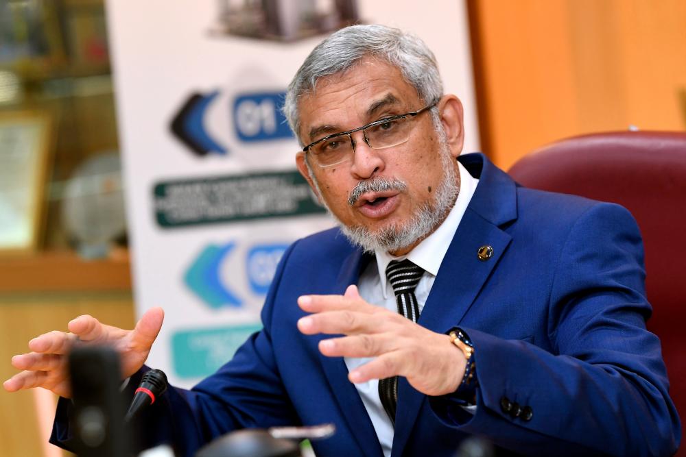 Federal Territory Minister Khalid Abdul Samad speaks at a press conference today. - Bernama