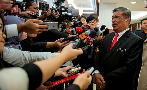 Filepix taken on July 8 shows Defence Minister Mohamad Sabu (right) at Parliament. — Bernama
