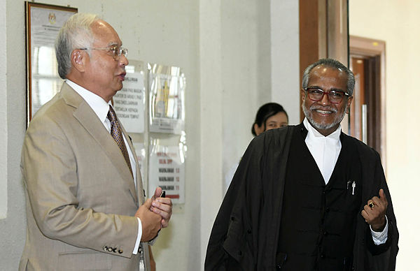 Filepix taken on Apr 17 shows former prime minister Datuk Seri Najib Abdul Razak (L) and his lawyer Tan Sri Muhammad Shafee Abdullah (R) at the Kuala Lumpur High Court.
