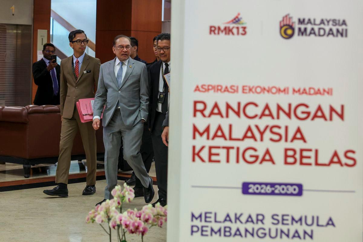 Prime Minister Datuk Seri Anwar Ibrahim arriving at the Dewan Negara to present the 13th Malaysia Plan (RMK13) on August 25, 2025. - BERNAMA