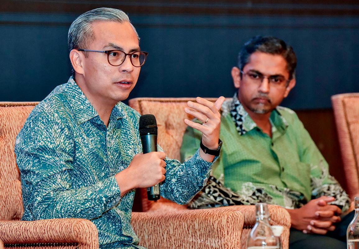 Communications Minister Datuk Fahmi Fadzil delivers a talk during the Keynote Forum: Online Safety in the World of AI with youths at the World Trade Centre Kuala Lumpur today. - BERNAMAPIX
