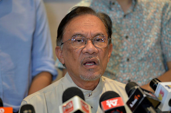 Filepix taken on June 23 shows PKR president Datuk Seri Anwar Ibrahim speaking at a press conference in the Merchant Square PKR Headquarters. — Bernama