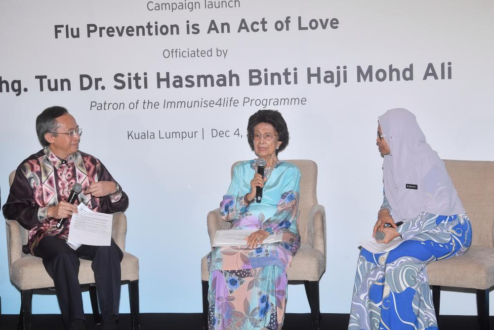 Tun Dr Siti Hasmah Mohd Ali (C) participates in the launch of the Flu Prevention is an Act of Love campaign organised by the Immunise4Life (IFL) today. - Bernama