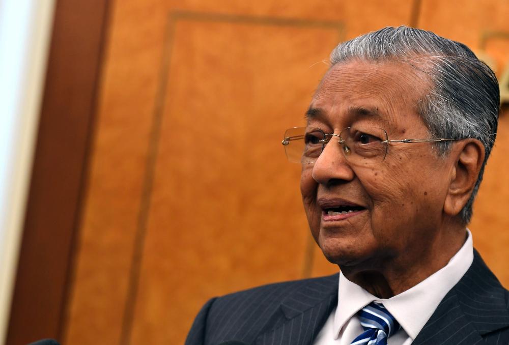 Prime Minister Tun Dr Mahathir Mohamad speaks during a press conference at Parliament. - Bernama