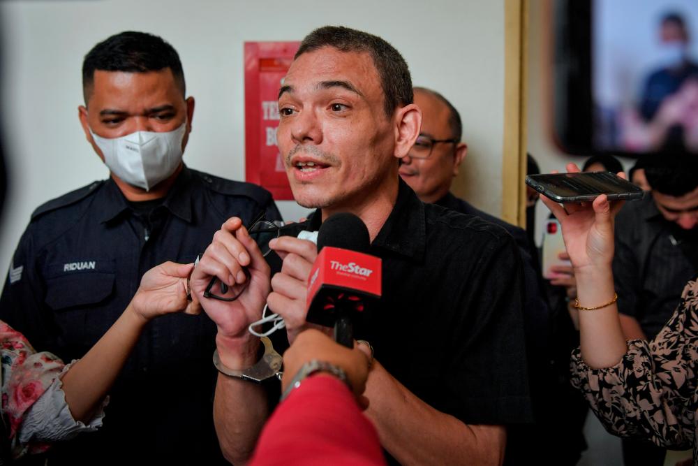 PETALING JAYA, Jan 11 -- Nasyid singer and composer, Muhammad Yasin Sulaiman (second, left) was met by reporters after leaving the Petaling Jaya Sessions Court today. BERNAMAPIX