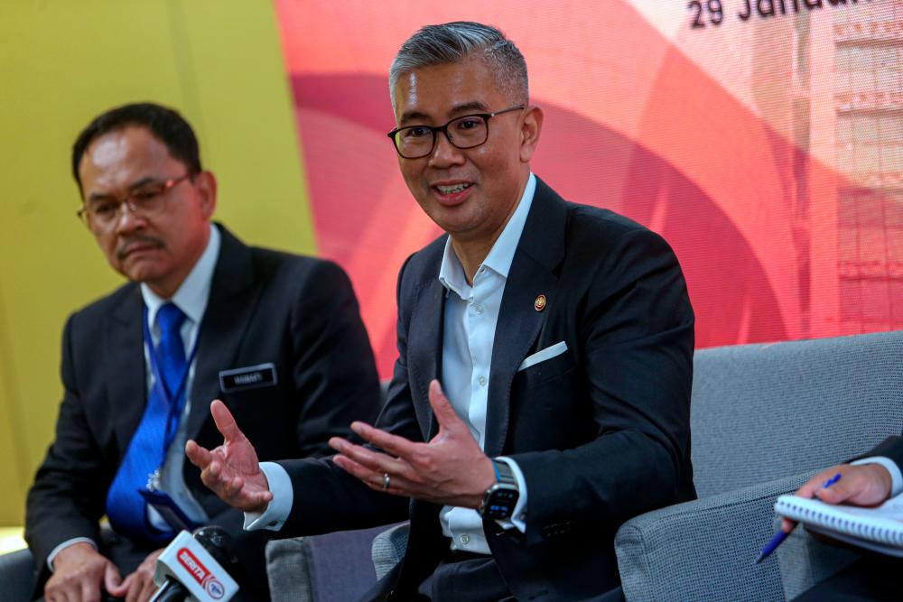 Tengku Zafrul (right) speaking at a press conference at Miti Dialogue 2024. With him is Investment, Trade and Industry Ministry deputy-secretary general (industry) Datuk Hanafi Sakri. – Bernamapic