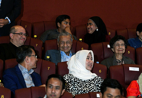 Prime Minister Tun Dr Mahathir Mohamad and wife, Tun Dr Siti Hasmah Mohd Ali react while watching the animated movie Ejen Ali The Movie at GSC Pavillion last night. — Bernama