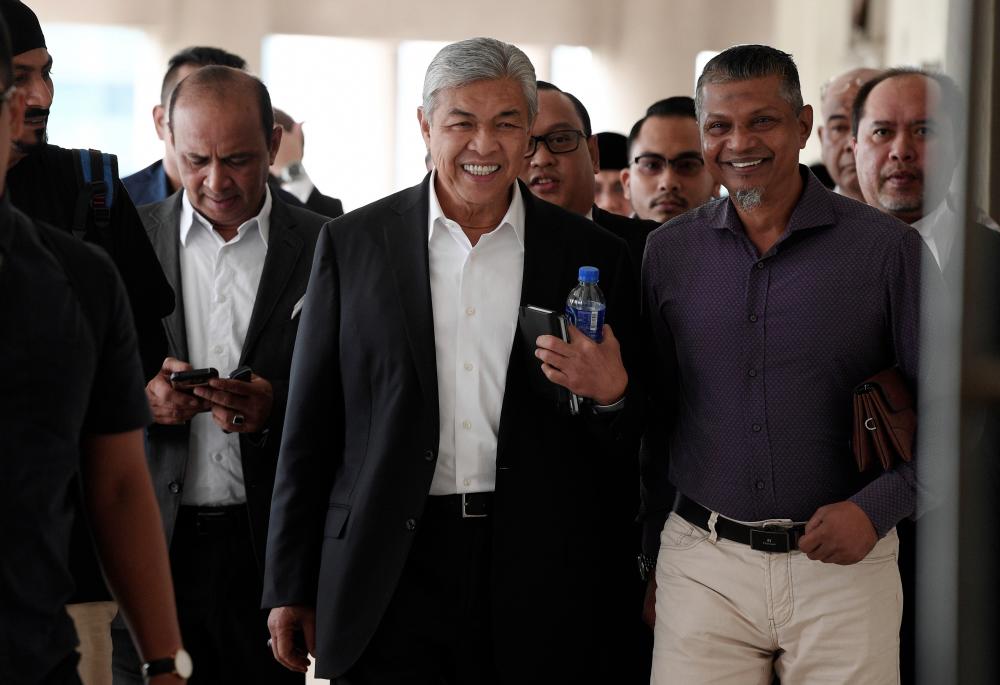 Former deputy prime minister, Datuk Seri Dr Ahmad Zahid Hamidi (C) who is facing 47 criminal charges of misappropriating Yayasan Akalbudi funds attends trial on Nov 18. — Bernama