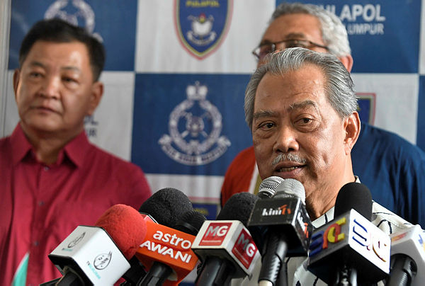 Home Minister Tan Sri Muhyiddin Yassin (R) at a press conference after attending a Hari Raya Open House at the Police Training Centre, Kuala Lumpur today. — Bernama