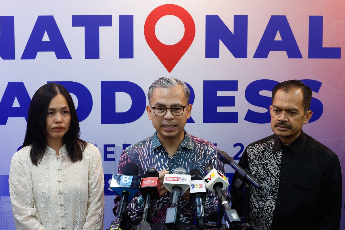 Communications Minister Datuk Fahmi Fadzil at a press conference after attending the National Addressing Conference 2025 at the World Trade Centre Kuala Lumpur (WTCKL) today. Also present were his Deputy Minister of Communications Teo Nie Ching and the Ministry’s Secretary-General Datuk Mohamad Fauzi Md Isa. – BERNAMA