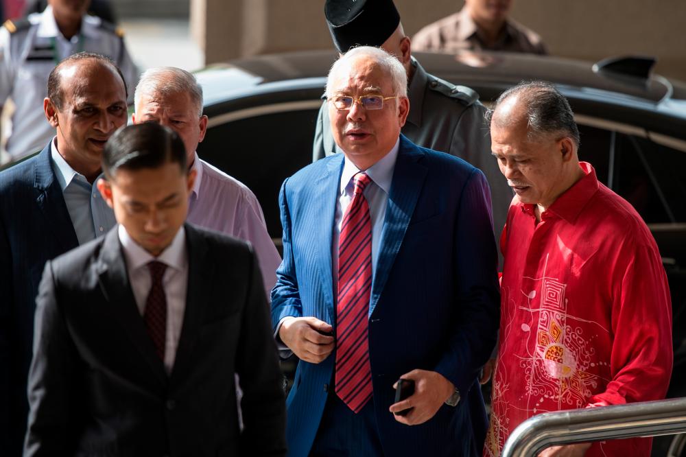 Former Prime Minister Datuk Seri Najib Abdul Razak arrives for the second day of his trial on the alleged tampering of the 1MDB final audit report at the Kuala Lumpur Court Complex today. - Bernama