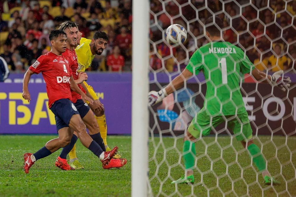 KUALA LUMPUR, Oct 22 -- Al-Seeb Club player Muhsen Saleh Al Ghassani (centre) shoots the ball into the goal while being blocked by two Kuala Lumpur (KL) City FC players in the 2022 AFC Cup Final between the KL City FC team against the team Al-Seeb Club at Bukit Jalil National Stadium. BERNAMAPIX