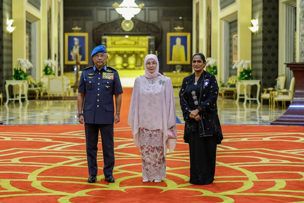 ‘You deserved it’, says Agong to courteous security guard Yogeswary after medal award