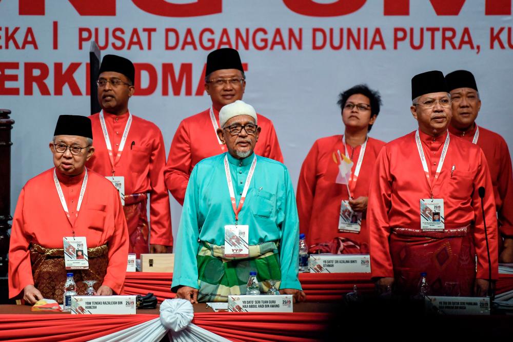 PAS president Datuk Seri Abdul Hadi Awang (front, 2ndL) with Umno secretary-general Tan Sri Annuar Musa (front R), and Umno veteran Tengku Razaleigh Hamzah (front L) with other fellow leaders, at the 73rd Umno general assembly, on Dec 6, 2019. — Bernama