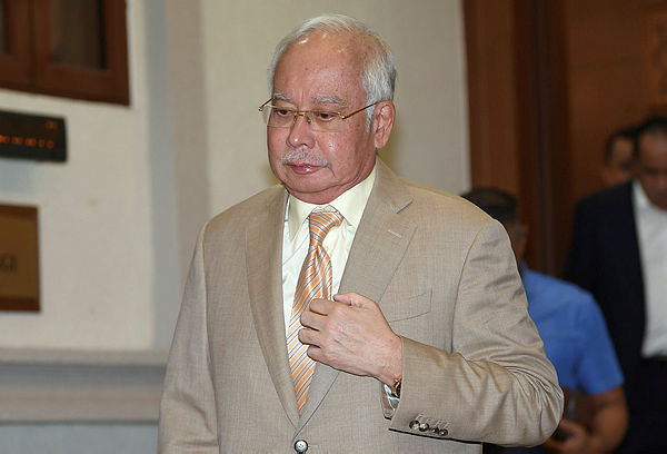 Filepix taken on June 10 shows former Prime Minister Datuk Seri Najib Tun Razak exiting the Kuala Lumpur High Court. — Bernama