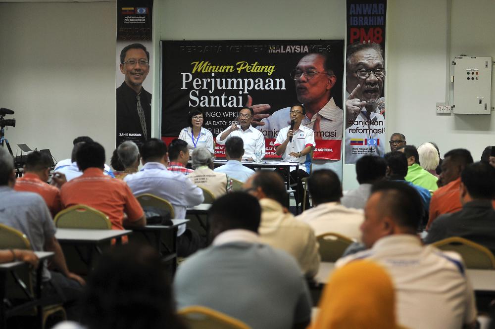 PKR president Datuk Seri Anwar Ibrahim speaks with representatives of NGOs during a ‘PKR Presidential Tour’ series on Aug 20, 2019. - Bernama