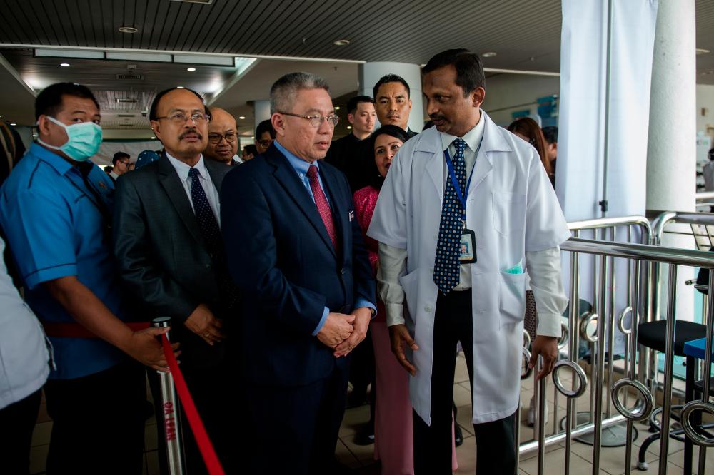 Health Minister Datuk Seri Dr Adham Baba (C) during a working visit to Sungai Buloh Hospital today. - Bernama
