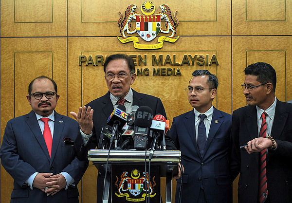 PKR president Datuk Seri Anwar Ibrahim at a press conference in parliament yesterday. — Bernama